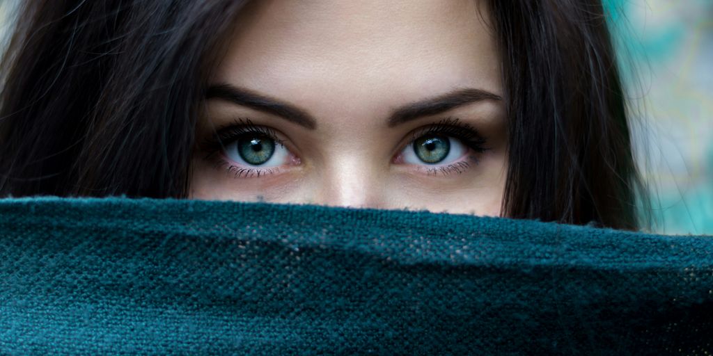 a close up of a person with blue eyes
