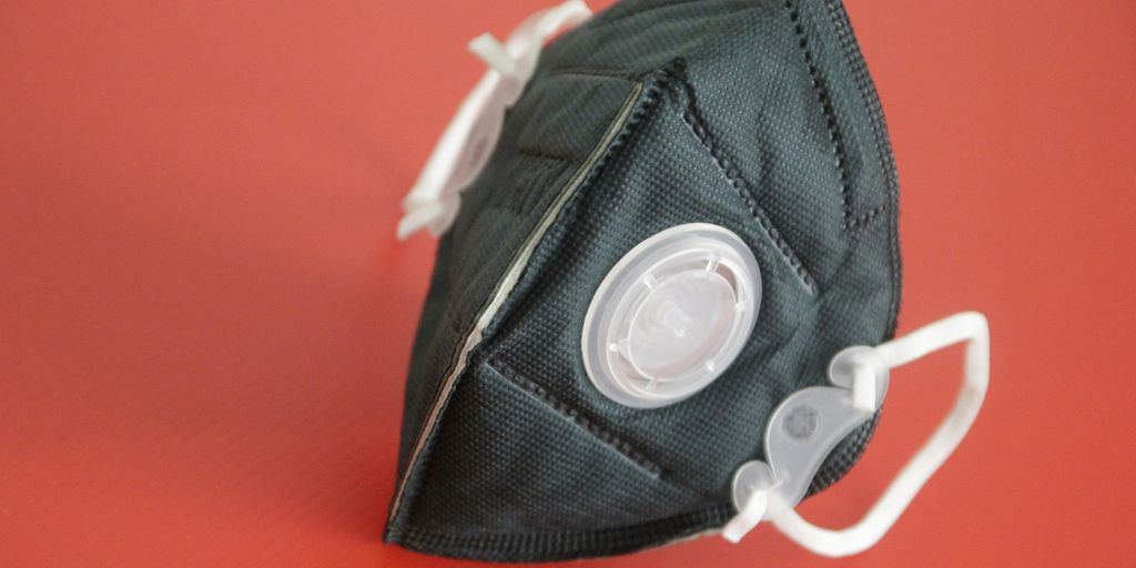 black and white backpack on red textile