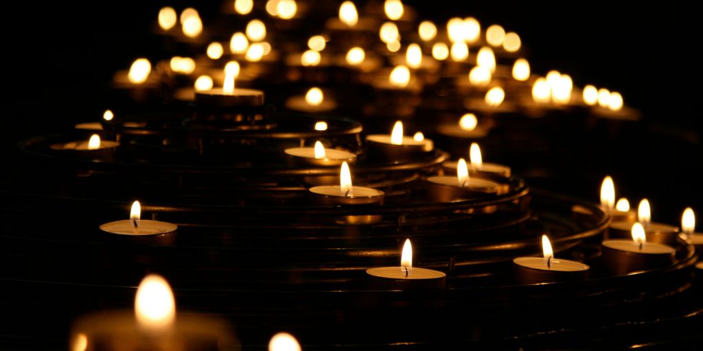 low-angle photo of lightened candles