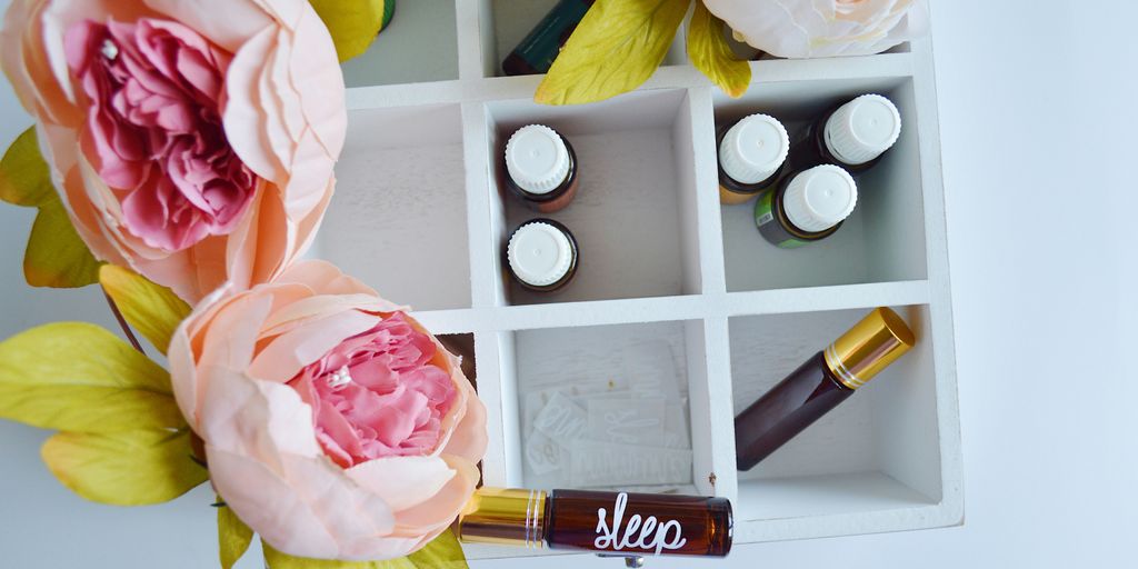 several vials in white wooden organizer shelf