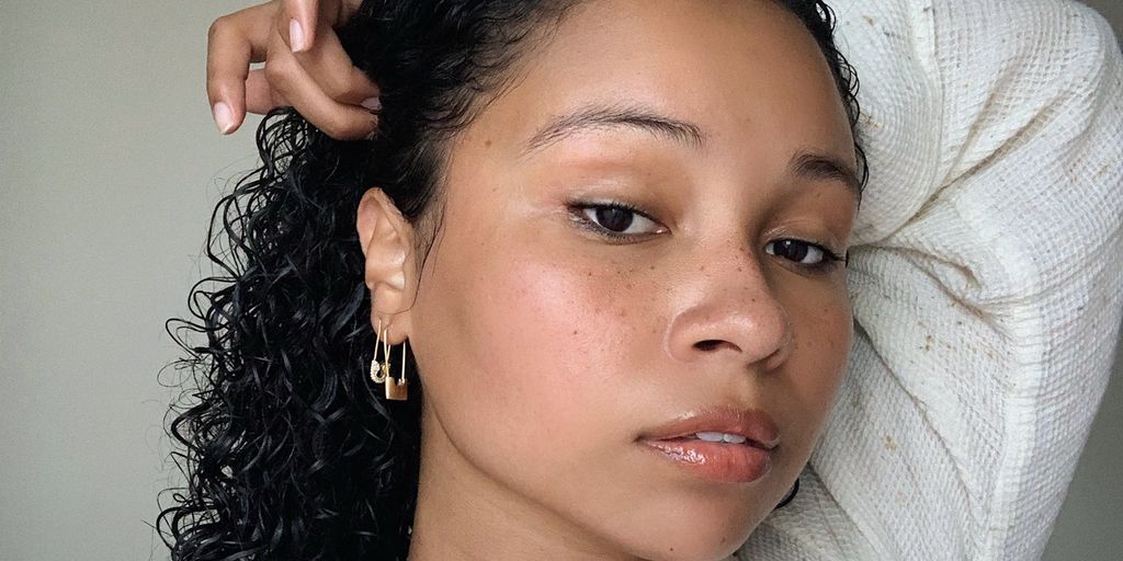 Person posing for a close-up selfie with natural makeup.