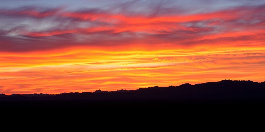 Vibrant sunset paints the desert sky above Tucson.