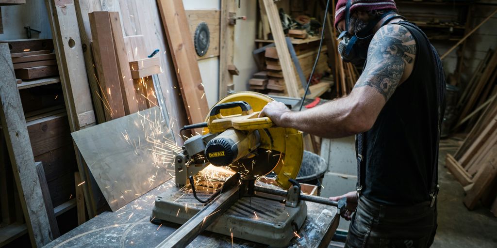 man using cut off saw