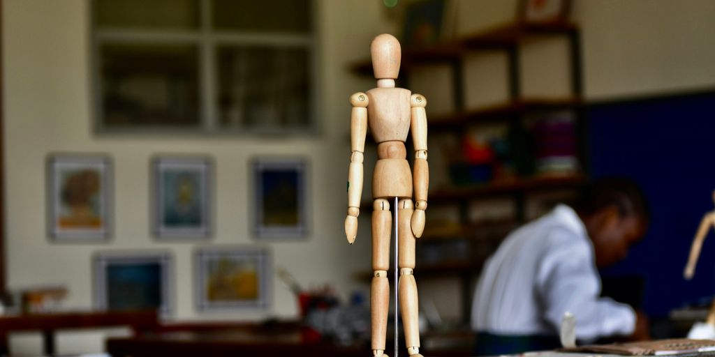 a wooden model of a human skeleton