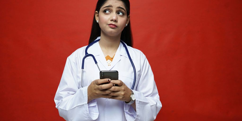 a doctor holding a phone