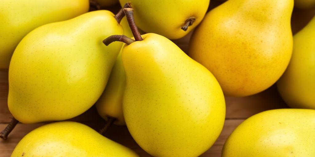 Fresh ripe pears on a wooden surface.