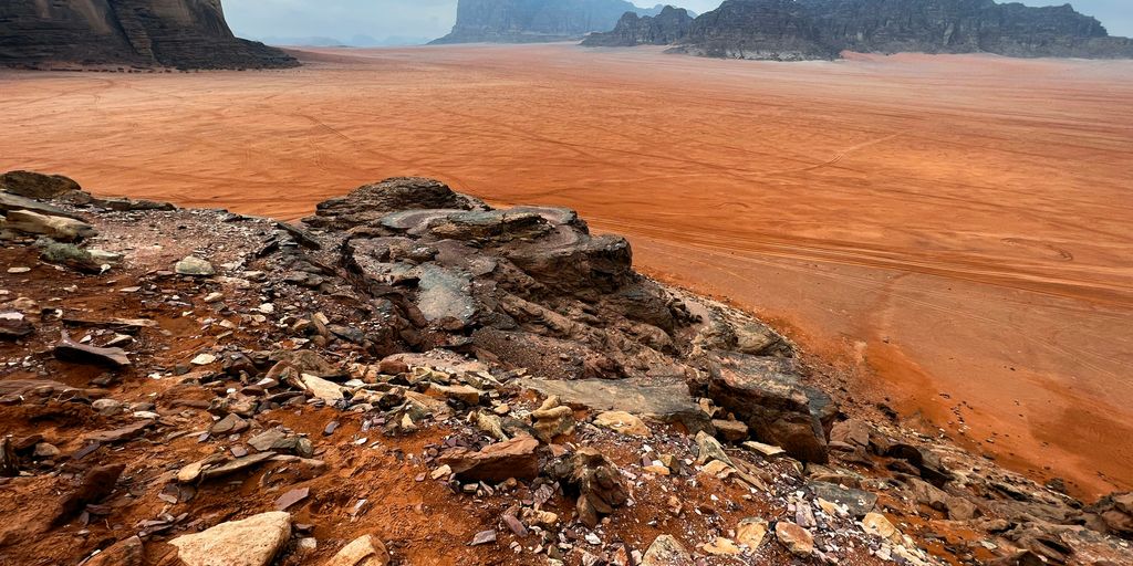 a rocky outcropping in the middle of a desert