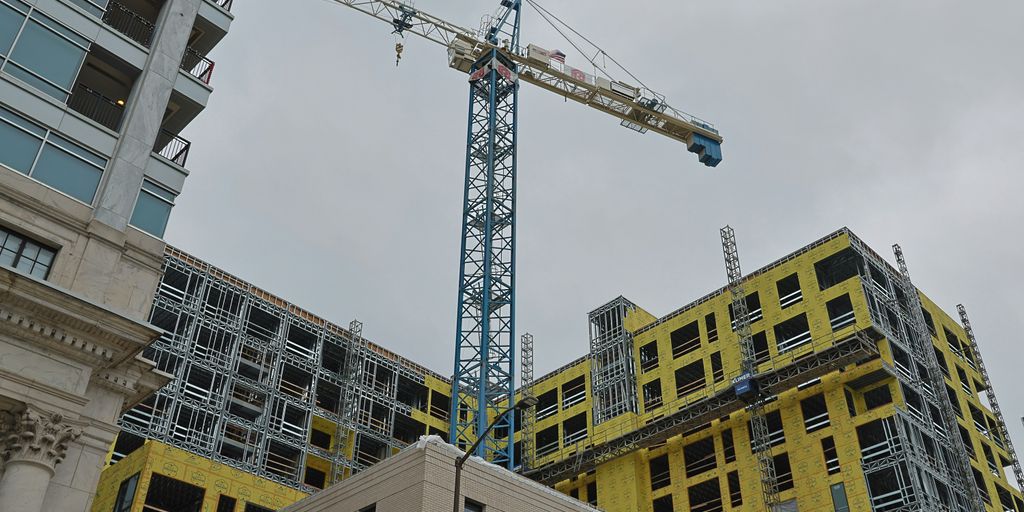 a crane that is on top of a building