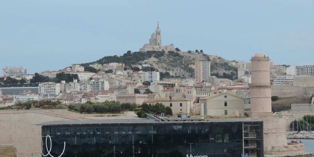 a view of a city with a hill in the background