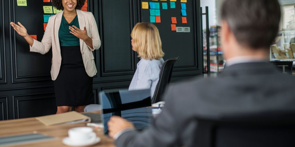 diverse group of professionals collaborating in modern office, showcasing teamwork and communication