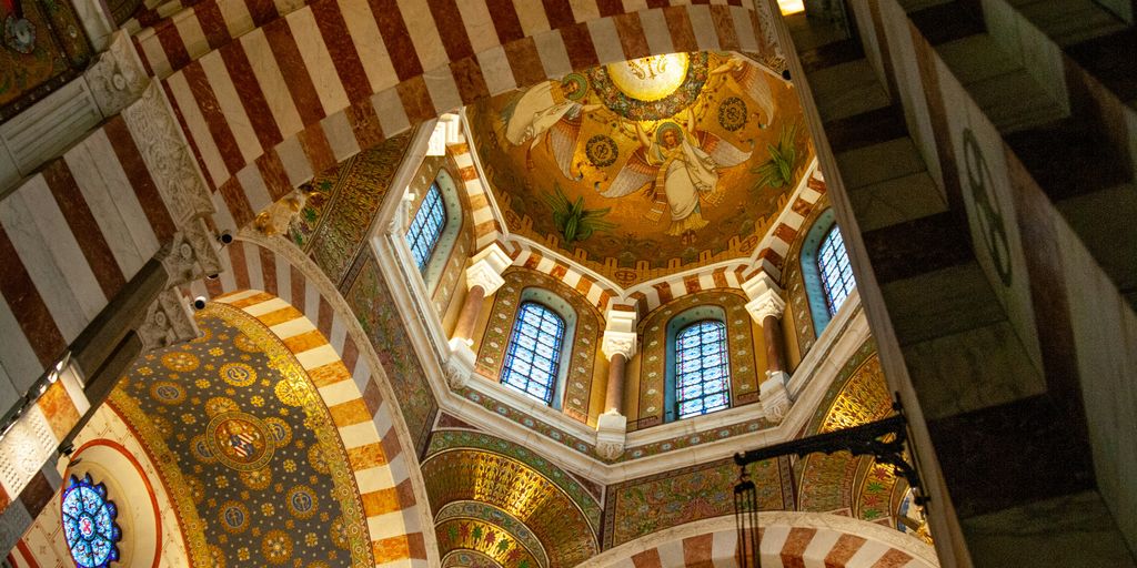 a large ornate room with stained glass windows