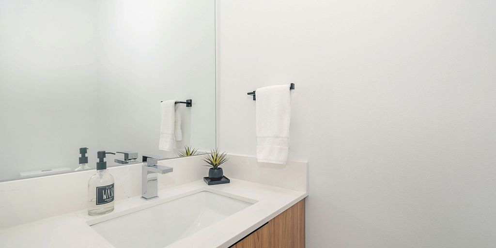 white ceramic sink with faucet