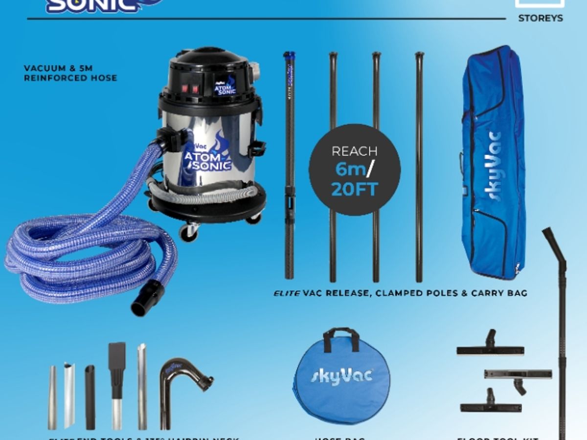 Vacuum cleaner kit with tools and accessories displayed neatly.