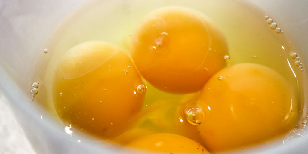 yellow liquid in white ceramic cup