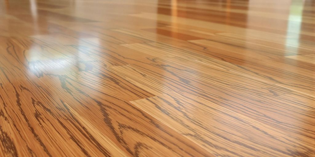 Close-up of a polished hardwood floor in a room.