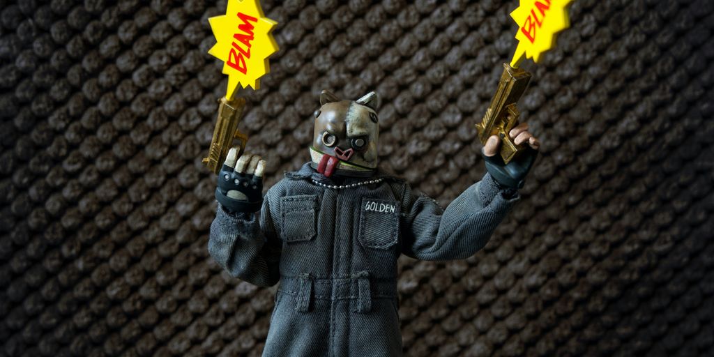 a toy figure holding two yellow stars in his hands