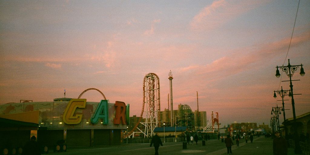 a group of people walking around a fair