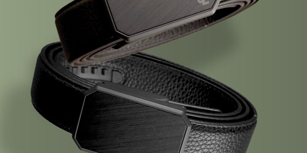 Two stylish belts in black and brown on a green background.