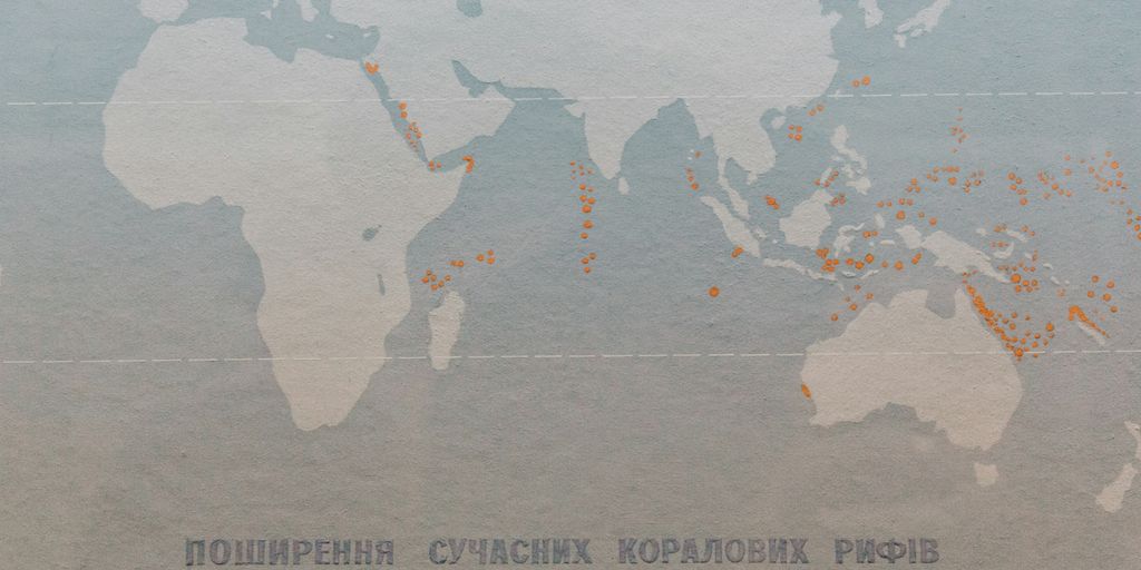 a map of the world with orange dots