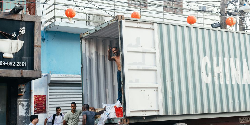 shallow focus photo of people beside gray truck