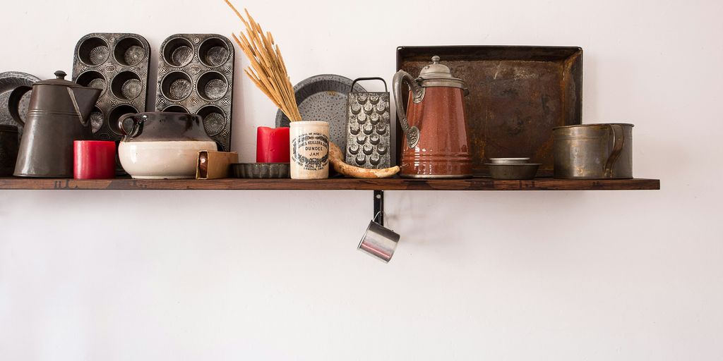 kitchen utensil lot on brown wooden floating shelf