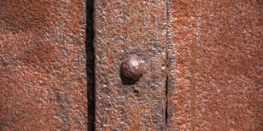 brown metal door knob on brown wooden door