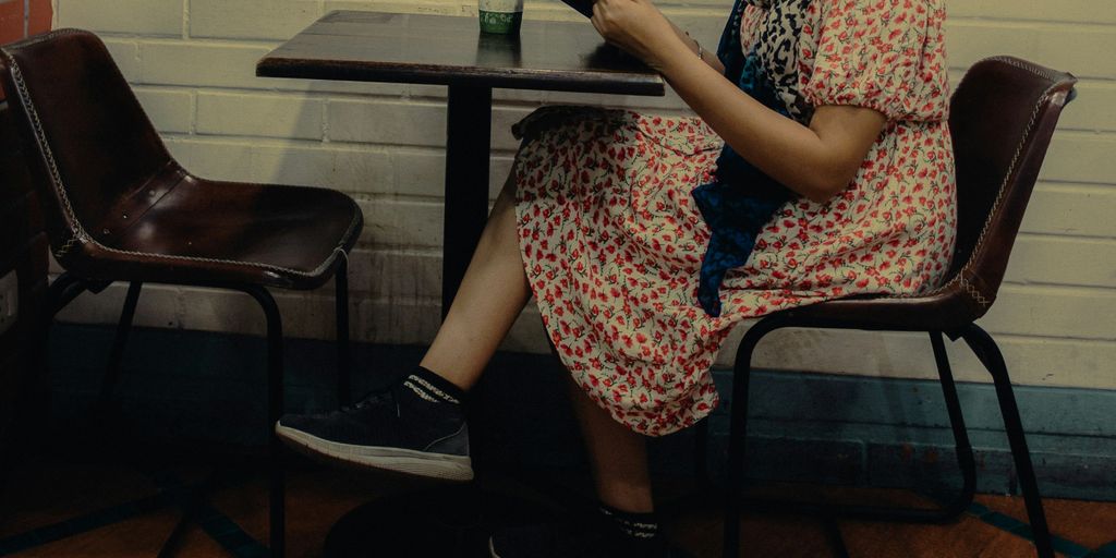 a woman sitting at a table