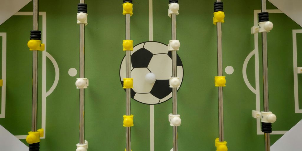 a group of black and yellow poles