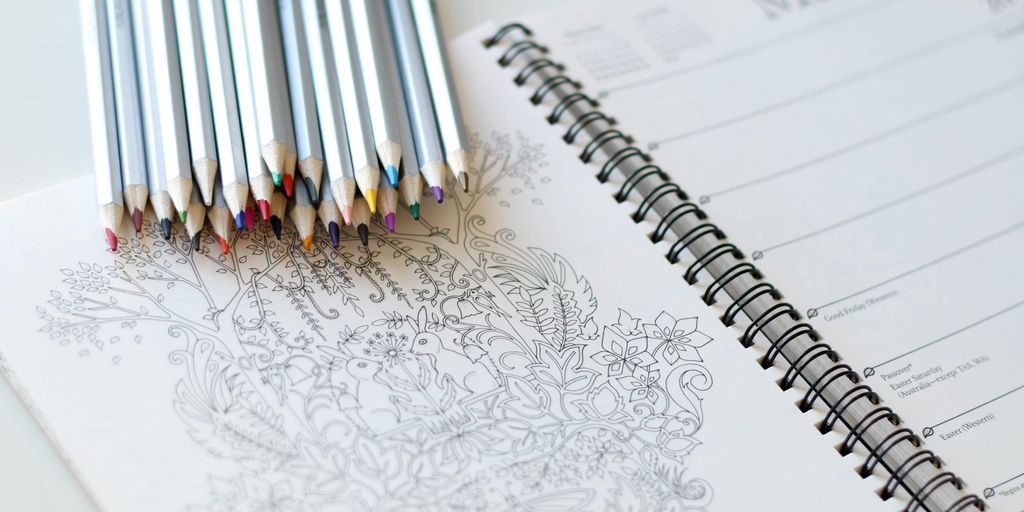 coloring pencils on notebook