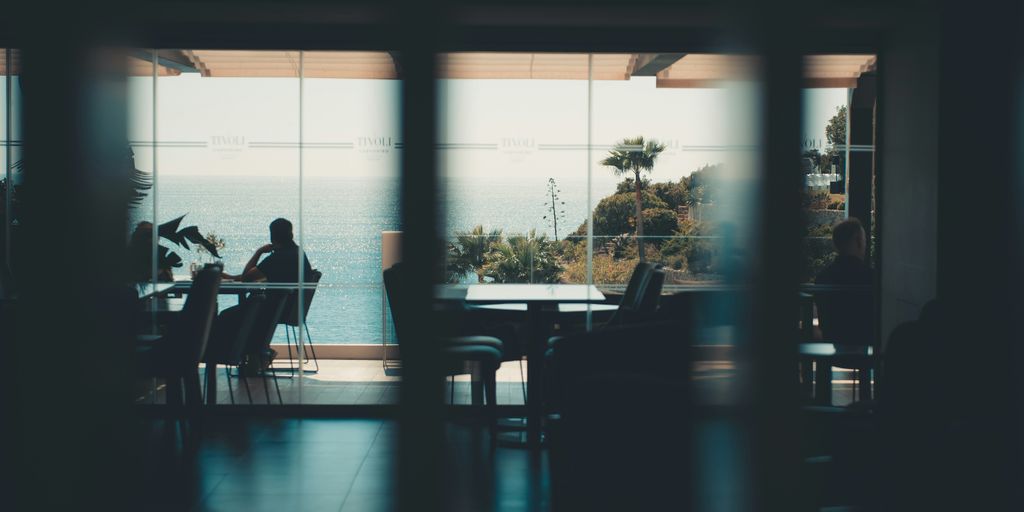 Dining room with a scenic, outdoor ocean view.