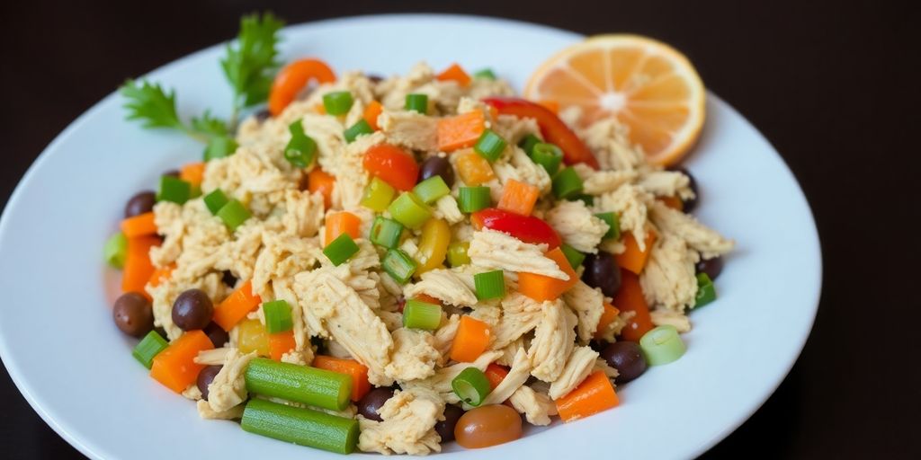 Ceia de natal simples e barata - 10 Receitas fáceis 2 Salpicão de frango com feijão em um prato colorido.