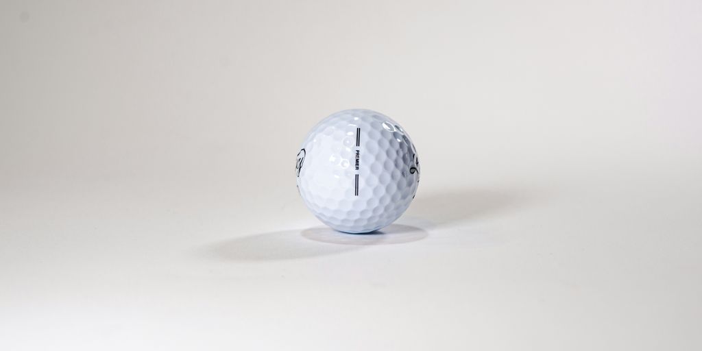 a golf ball sitting on top of a white table