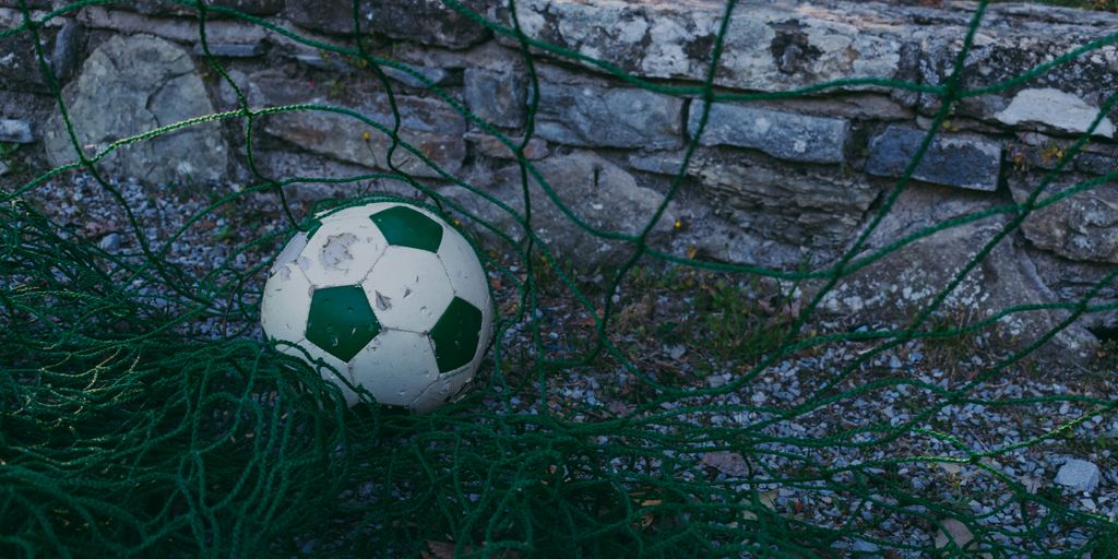 white and green soccer ball