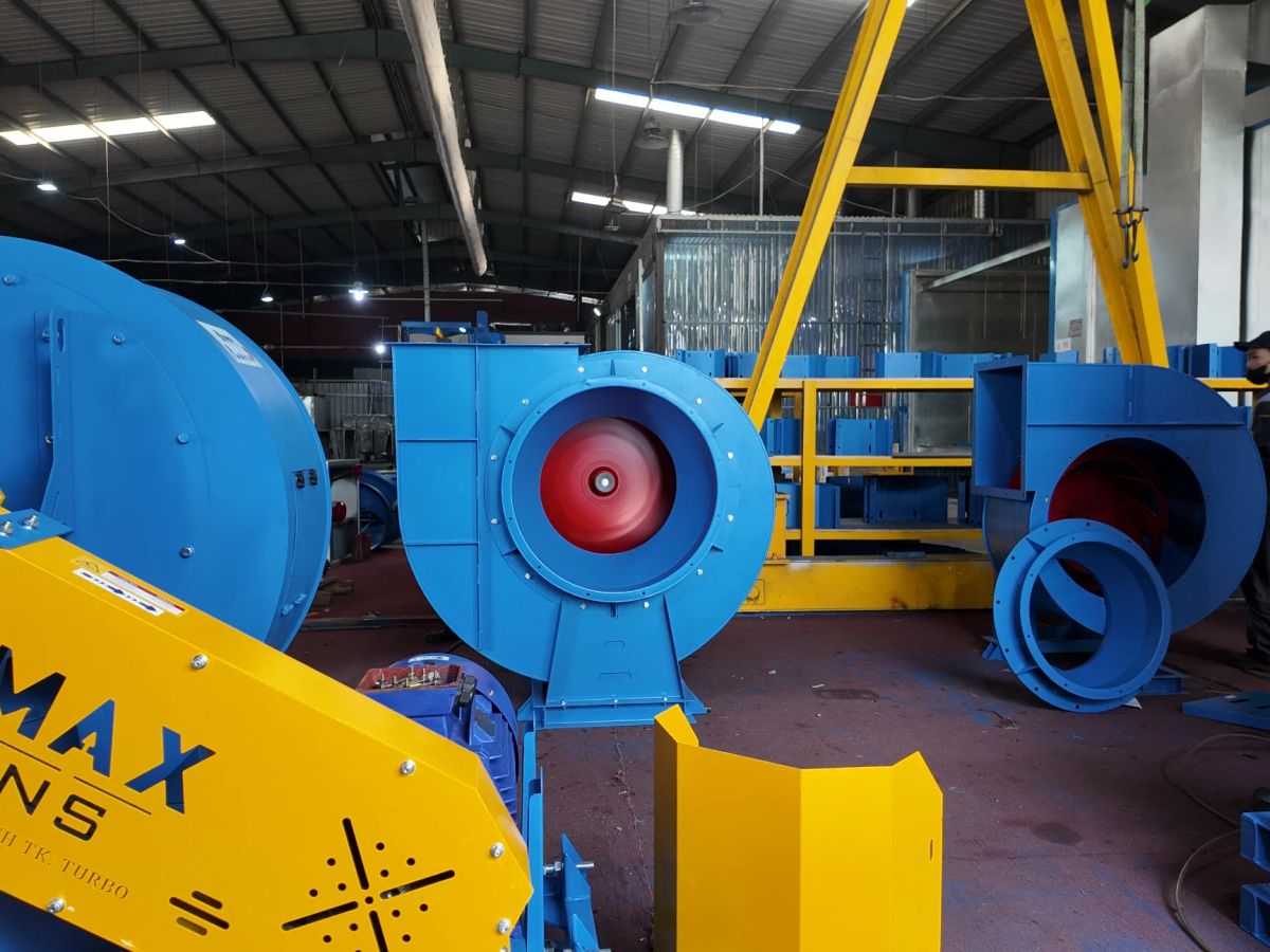 Industrial setting with colorful equipment and machinery components.