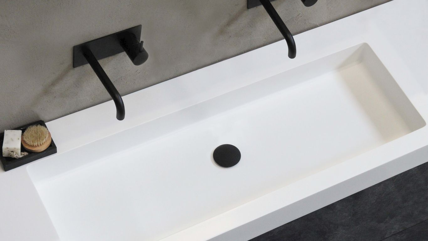 black rolling office chair beside white table