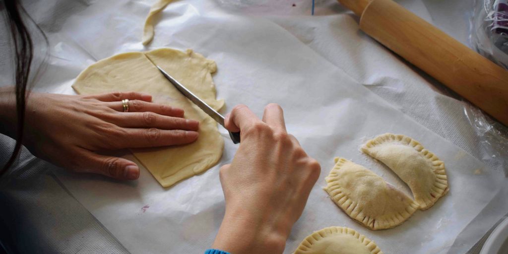 person making Empanadas