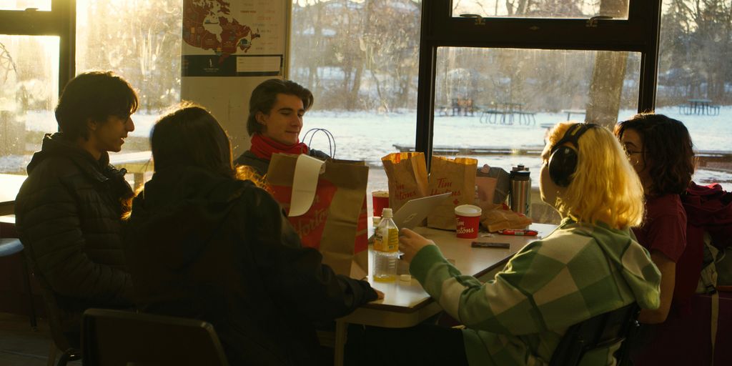 a group of people sitting around a table