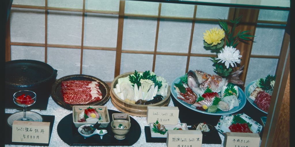 A display case filled with different types of food