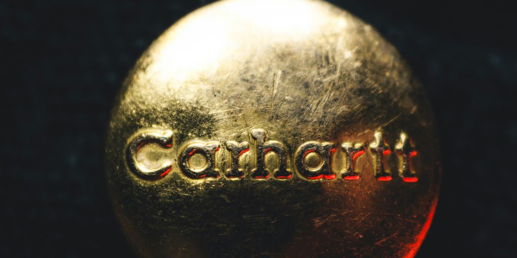 A close up of a golden ball with the word comfort on it