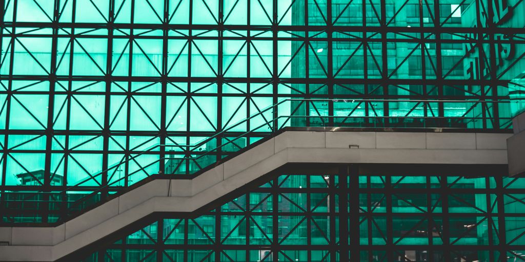 photography of white bridge in building