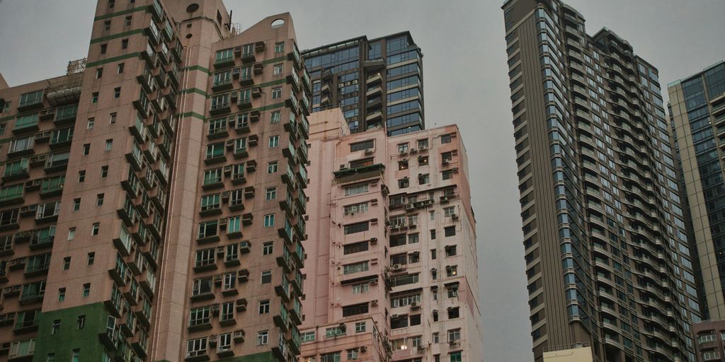 a group of tall buildings sitting next to each other