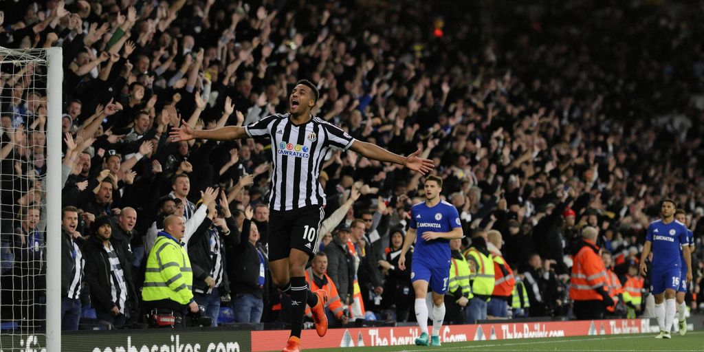 Newcastle player celebrates goal against Chelsea at home stadium.
