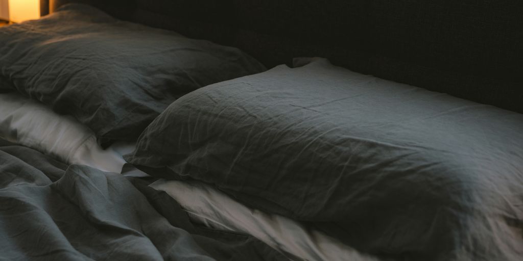 white bed pillow on bed