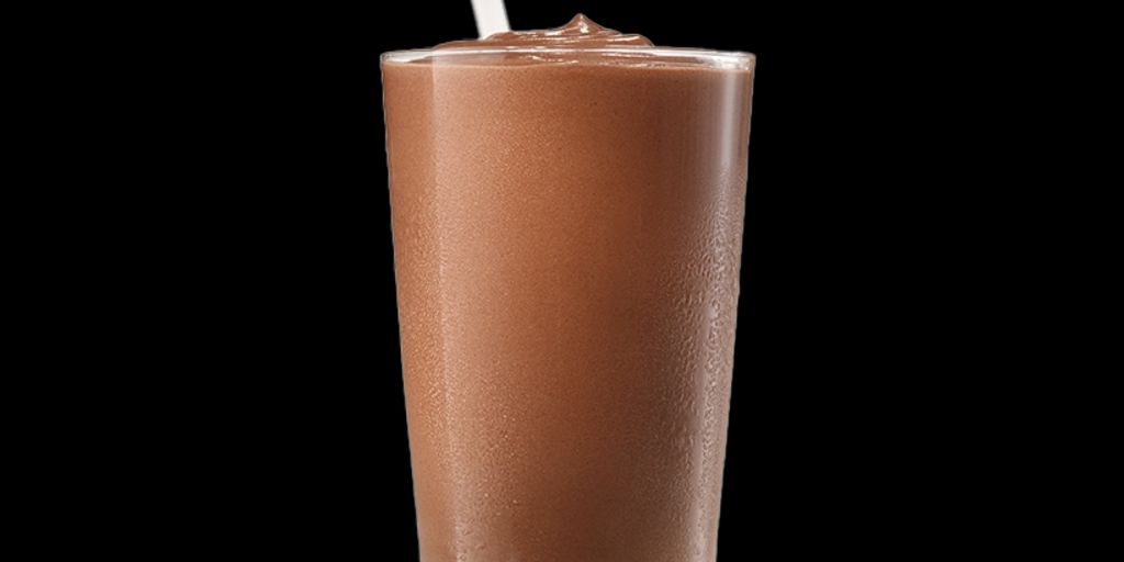 swimmer drinking chocolate milk poolside