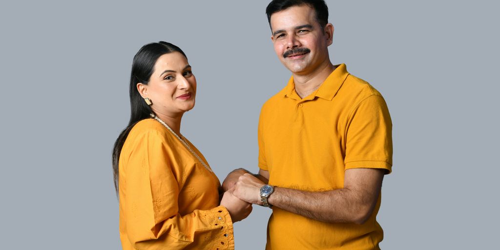 a man and woman holding hands