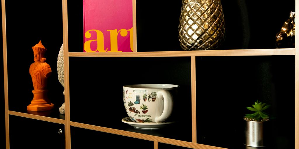 a shelf filled with vases and other items