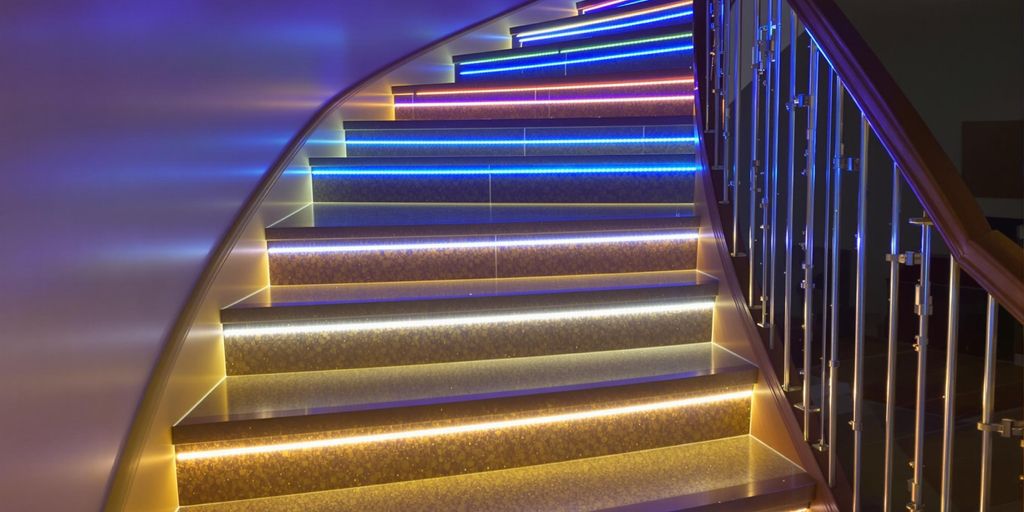 LED strips illuminate a stylish staircase for safety.