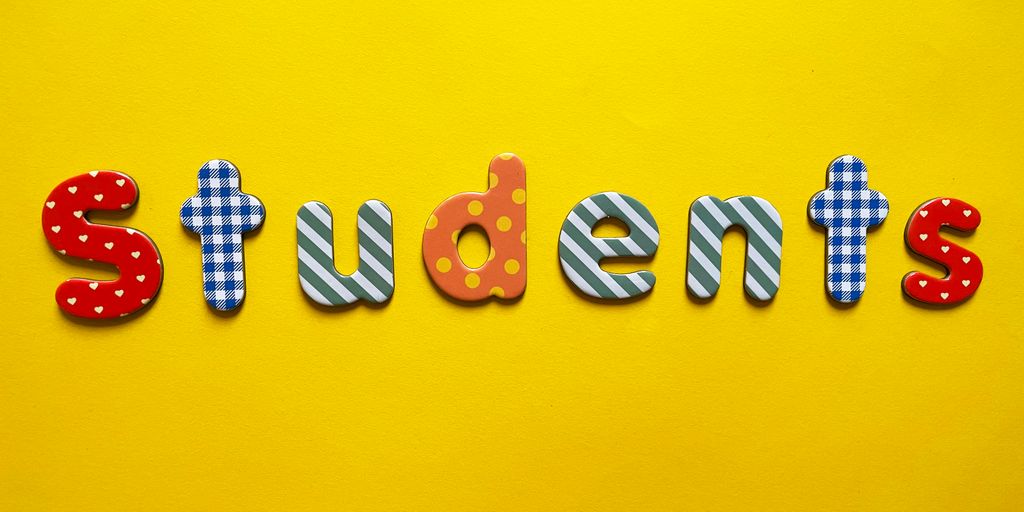 a yellow background with the word students spelled out