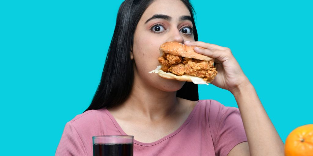 a woman eating a sandwich
