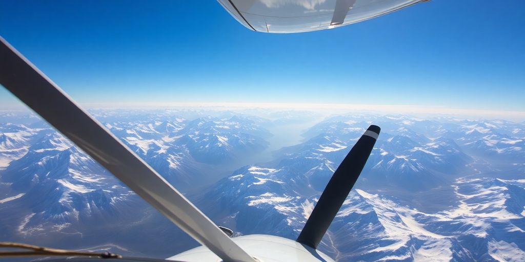 An aerial cockpit view of a plane over Alaskan mountains.